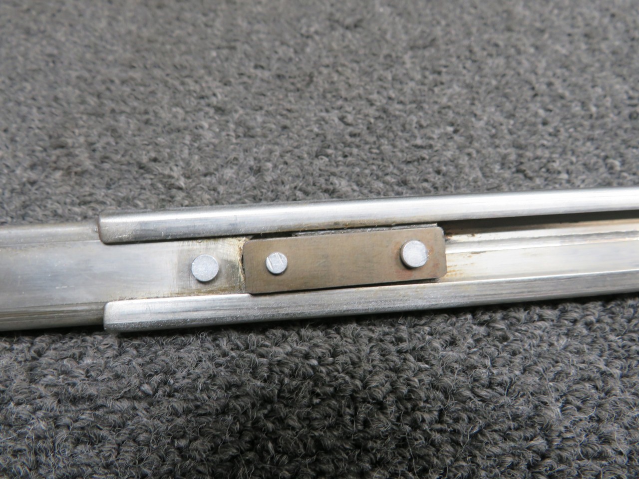 37666-000 (Use: 37666-800) Piper PA34-200T Nose Baggage Door Holder Assembly