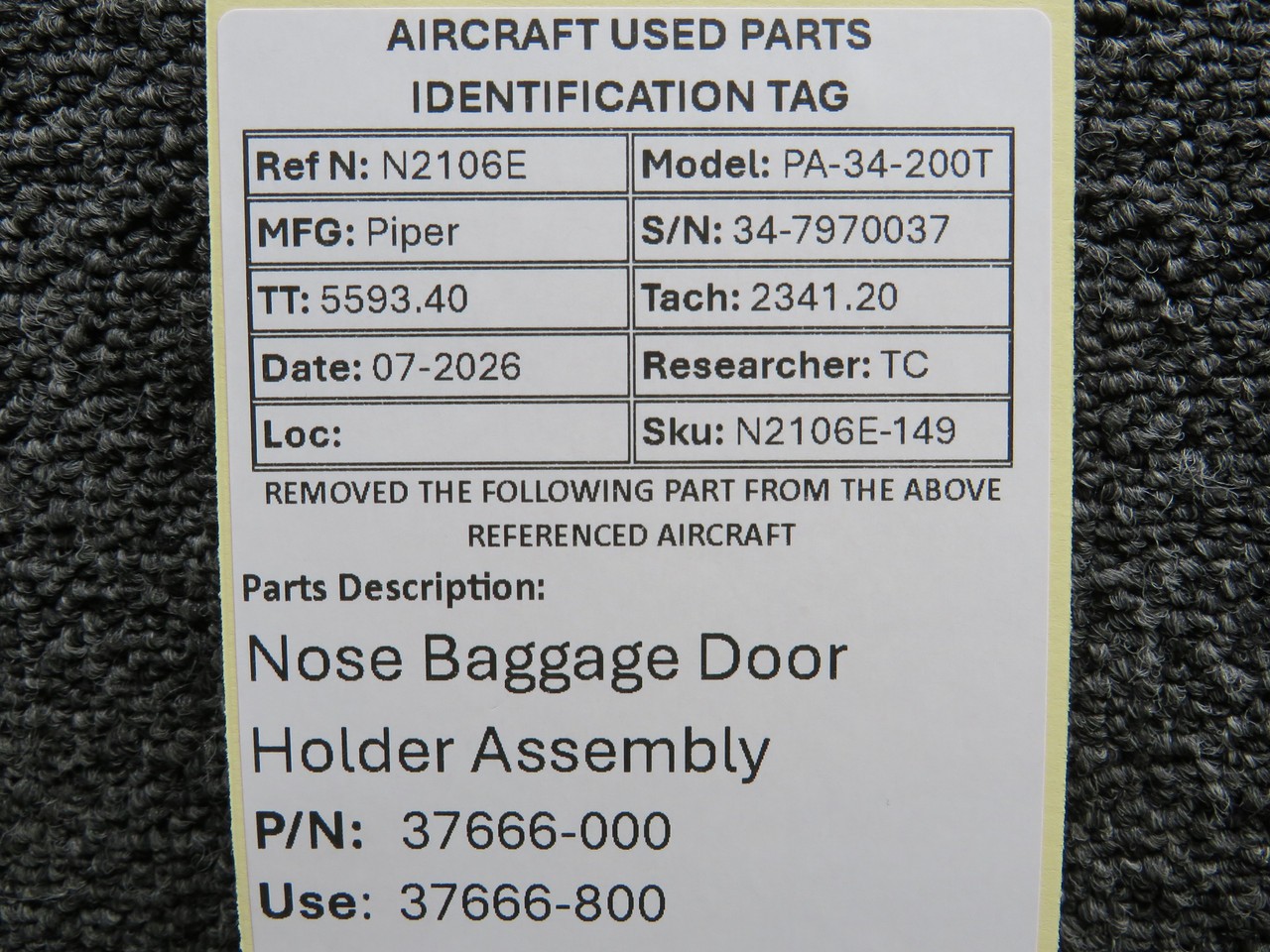 37666-000 (Use: 37666-800) Piper PA34-200T Nose Baggage Door Holder Assembly